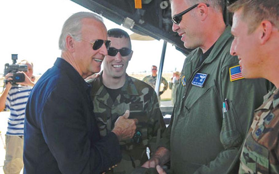 Sen. Joe Biden, D-Del., talks with from left, Staff Sgt. Jason Tipler, Master Sgt. Ray Hensley and Staff Sgt. Chris Droegemueller, at the Tbilisi, Georgia, airport on Sunday. Hensley is a load master on a Ramstein, Germany-based C-130 Hercules that was delivering humanitarian aid to the Georgian capital. Tipler and Droegemueller of the 86th Air Mobility Squadron are unloading the U.S. Air Force planes ringing aid to the Georgian capital. Biden was on a quick fact-finding trip to the country.