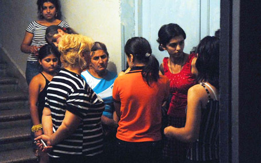 Refugees from South Ossetia line up to register at a displaced persons center set up in a school in Tbilisi, Georgia.
