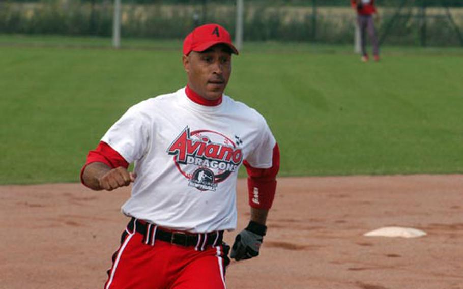 Clint Wilkerson sprints for third in opening day action during USAFE’s annual softball tournament at RAF Lakenheath.