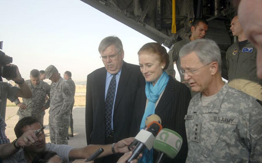 Army Gen. John Craddock, right, U.S. European Command commander, answers questions Friday while standing at the tail end of a C-130 at Tbilisi Airport in Georgia. To Craddock’s left are Henrietta Fore, U.S. Agency for International Development administrator, and John Tefft, U.S. ambassador to Georgia.