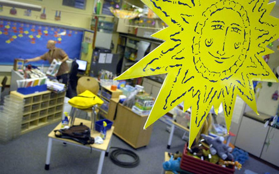The sun is out in this Wiesbaden, Germany, school as Andy Miller works furiously to set up his classroom Thursday. Miller, a veteran teacher with nine years at DoDDS, teaches 1st and 2nd grade at Aukamm Elementary School.