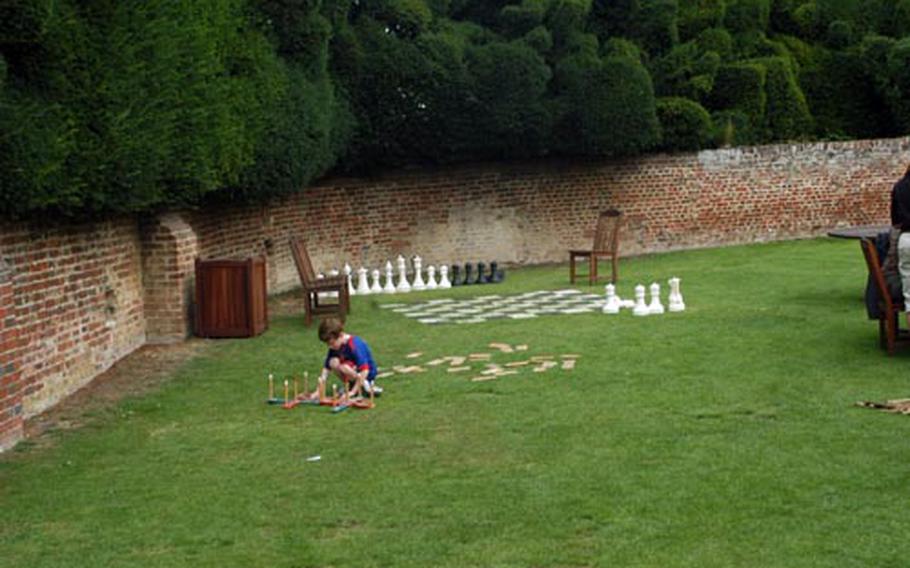 A boy plays with a one of the various games strewn about the lawn at Audley End House in Essex. With tours of the lavish interiors, working servants' quarters and lush gardens, it's a place you can spend the day exploring.