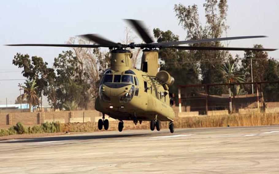 A CH-47F Chinook Improved Cargo helicopter comes in for a landing on Camp Taji's helipad landing this week. These new Chinooks are the first of their kind to hit the battlefield in Iraq and are being flown by the Combat Aviation Brigade, 4th Infantry Division.