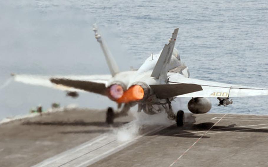 An F/A-18C Hornet, assigned to Strike Fighter Squadron (VFA) 258, launches from the catapult of the USS Ronald Reagan. The Reagan has assumed operations in the Middle East from the USS Abraham Lincoln.