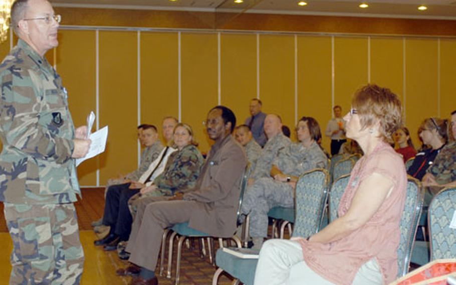 Lt. Col. Steven Nicolai, 35th Fighter Wing chaplain, talks about services available through the chapel during a town hall meeting Tuesday morning at Misawa Air Base, Japan. The event was geared toward military members preparing to deploy later this month and their spouses.