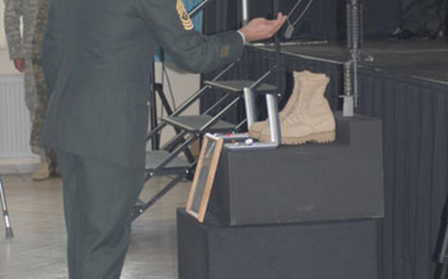 A soldier pays his last respects at Hohenfels to Pfc. Tan Ngo, who was killed in action in Afghanistan on Aug. 27.
