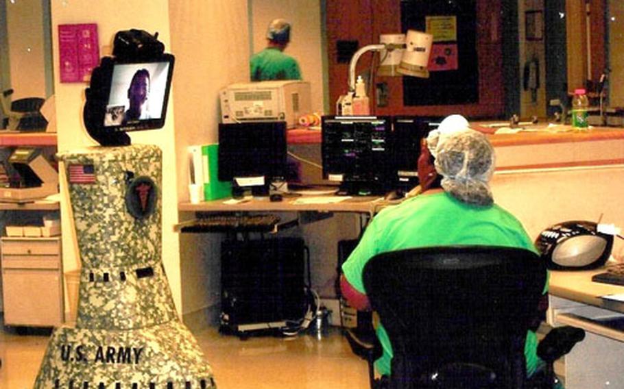 The RP7 mobile robot can roll to a patient’s bedside and enable two-way, real-time communication between a physician and a patient, the patient’s family, other physicians and nurses.