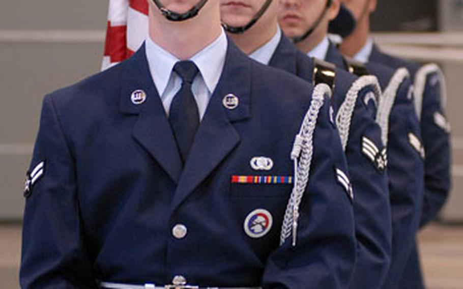 An Air Force color guard wait for its cue, as they take part in the activation ceremony for the 521st Air Mobility Operations Wing at Ramstein Air Base, Germany, on Thursday.