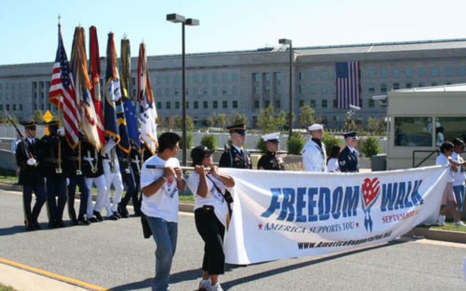The U.S. Joint Service Color guard along with participants at the America Supports You Freedom Wall parade towards the Pentagon on Sunday.