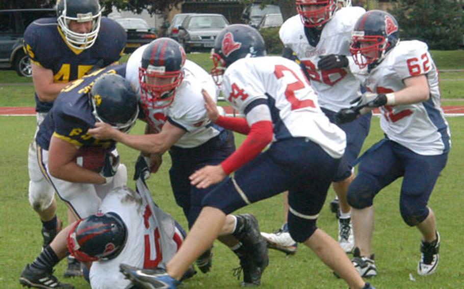 The Lakenheath Lancer defense comes full force against the Norwich Devils at Saturday’s high-school football jamboree at RAF Lakenheath.