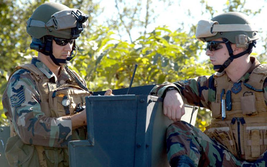 Tech. Sgt. Christian Jensen, left, and Airman 1st Class Ryan Schaffer work together during the 14th Fighter Squadron's recent close air support training at Misawa Air Base, Japan. Jensen, a joint tactical air controller, and Schaffer, a radio operator maintainer and driver, are assigned to Camp Red Cloud, South Korea. Their job is to help guide pilots' eyes on a target or situation on the ground.