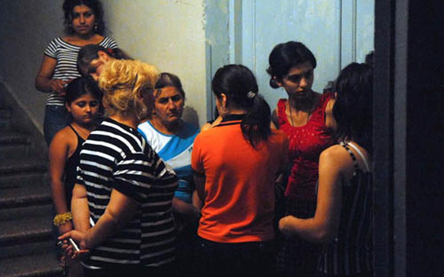 Refugees from line up to register at a displaced persons center center in a school in Tbilisi, Georgia on Aug. 17.
