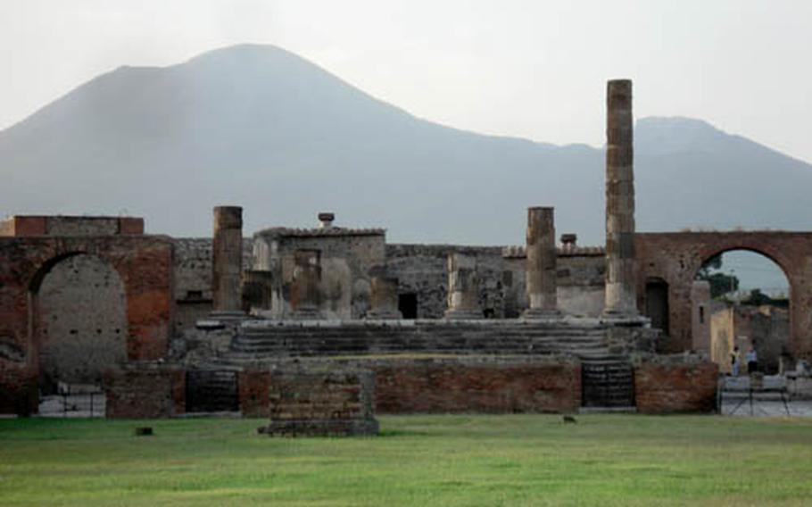Mount Vesuvius looms behind the Forum of Pompeii, destroyed by the famous mountain’s devastating eruption of A.D. 79.