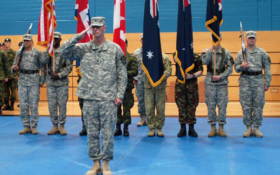 Soldiers from the U.S., Britain, Canada, Australia and New Zealand parade at Hohenfels, Germany, on Friday to kick off a month-long exercise.