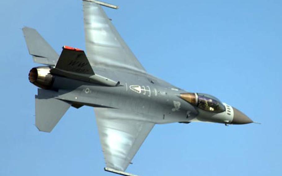 Maj. Mike Briggs, the U.S. Pacific Air Forces F-16 demonstration team pilot, performs this summer at an air show at Chitose in Japan.