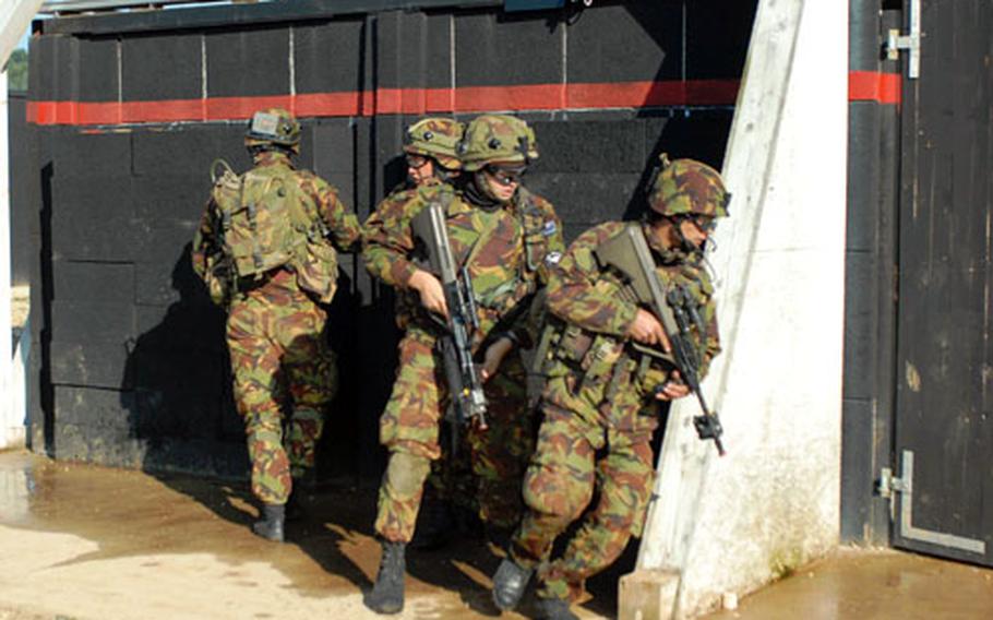 New Zealand soldiers clear a shoothouse at Hohenfels last Friday.