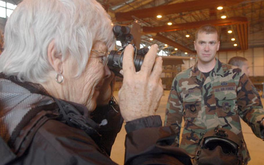 W. Allen Morris, a commercial real estate broker from Coral Gables, Fla., checks out a rifle on display at RAF Lakenheath, England, on Tuesday as part of the Joint Civilian OrientationConference, a weeklong tour of military facilities for civilians sponsored by the Department of Defense.