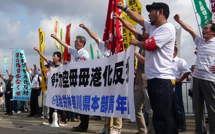 Protesters chant their opposition to the deployment of the nuclear-powered USS George Washington to Japan. Approximately 350 protesters gathered at Umikaze Park in Yokosuka city as the ship pulled into Yokosuka Naval Base.