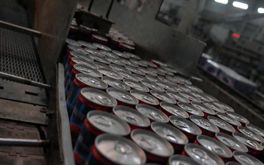 “Summer Cola” fills up the Dijla Soft Drink Co. production line Tuesday in Baghdad’s Abu T’shir district. Healthy factories like this will be essential to growing Iraq’s economy beyond the small shops that currently dominate the country’s business landscape.
