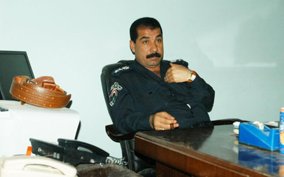 Col. Faroq Taih Hardan, Haditha’s chief of police, sits at his office on Thursday.