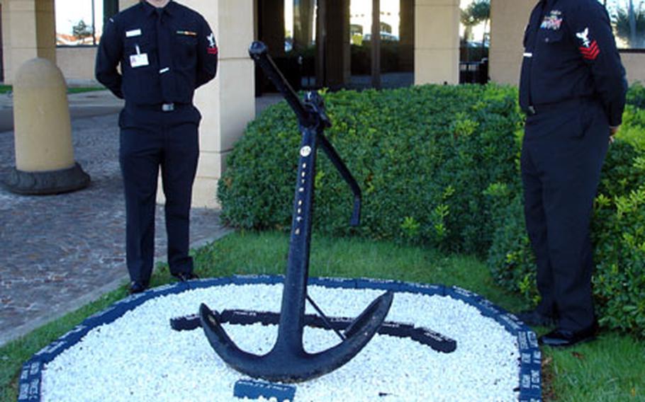 Petty Officer 2nd Class Andrew Hoysock, left, and Petty Officer 1st Class Byron Thompson Sr. created a memorial garden at the entrance of U.S. Naval Hospital Naples to honor Naval medical community Medal of Honor recipients and Navy medical personnel listed as missing in action in past conflicts.