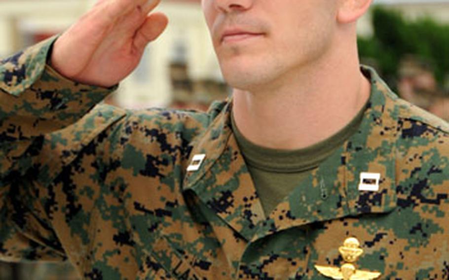 Capt. Luke Lazzo, 27, from Rochester, Mich., commander of 1st Platoon, Company A, 3rd Reconnaissance Battalion, salutes after receiving a Bronze Star with V device during a ceremony on Wednesday at Camp Schwab, Okinawa.