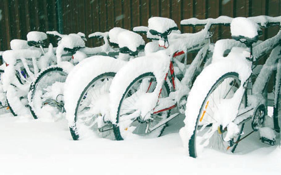 Snow piled up on a row of bicycles parked at Smith Barracks in Baumholder.