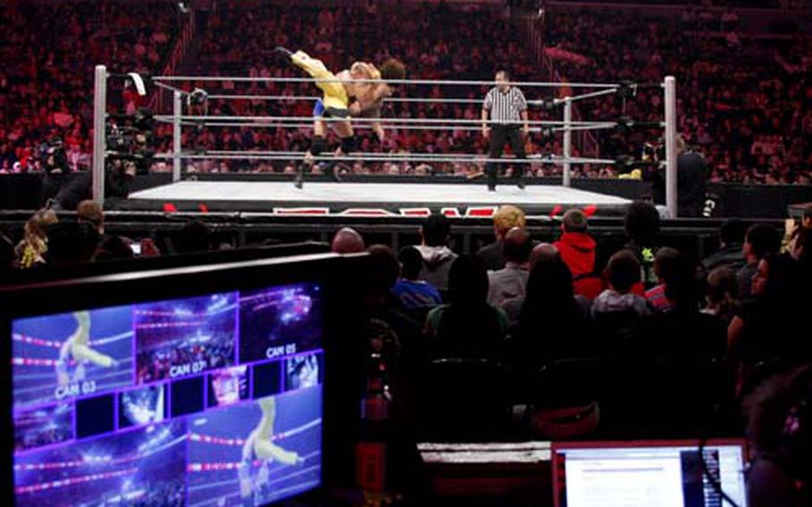 The World Wrestling Entertainment production crew monitors camera angles at the Verizon Center on December 1.