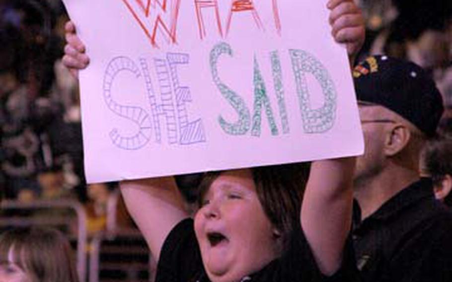 Casey Shingler cheers at the Dec. 1 RAW show at the Verizon Center. Shingler&#39;s father, Army Maj. Louis Dorfman, received free tickets through the Wounded Warriors program.