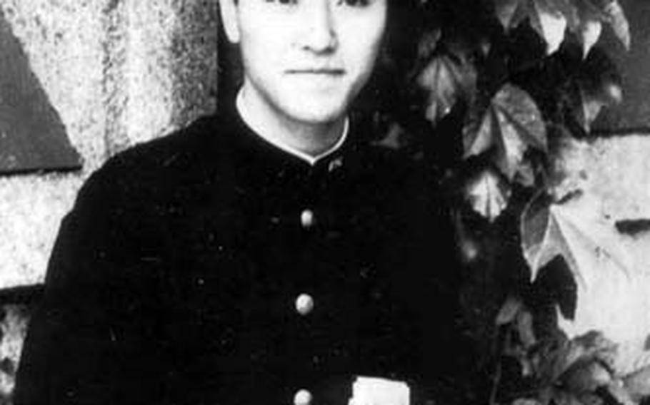 Kiyoshi Ogawa poses for a picture in his school uniform. The Kamikaze pilots were recruited from a group of gifted students.