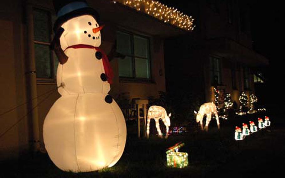 Christmas decorations glow brightly outside a home at Yokota Air Base, Japan.