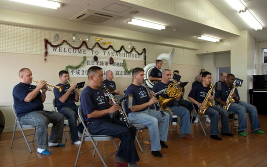 Members of the U.S. Army Japan Band from Camp Zama perform Monday at the Takashihoen facility for developmentally disabled adults in Yomitan Village on Okinawa.