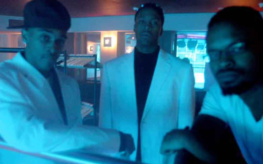 From left, Coleman, Marsh and Bradford Trice, a civilian employee at RAF Lakenheath, form the group Money Train, which organized and performed the talent showcase.