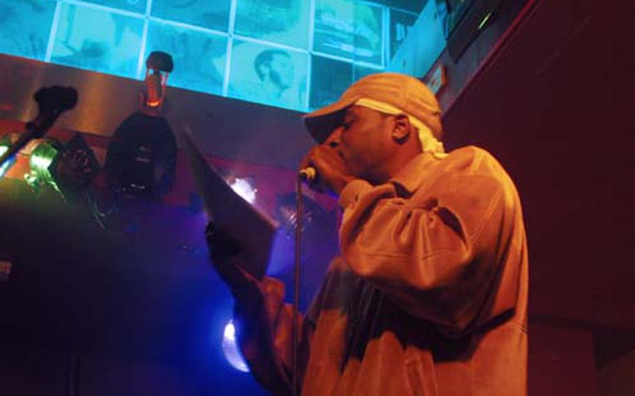 Staff Sgt. Craig Williams, a member of the 100th Communications Squadron at RAF Mildenhall, performs a spoken word poem at a charity event last week at the Soul Tree in Cambridge.