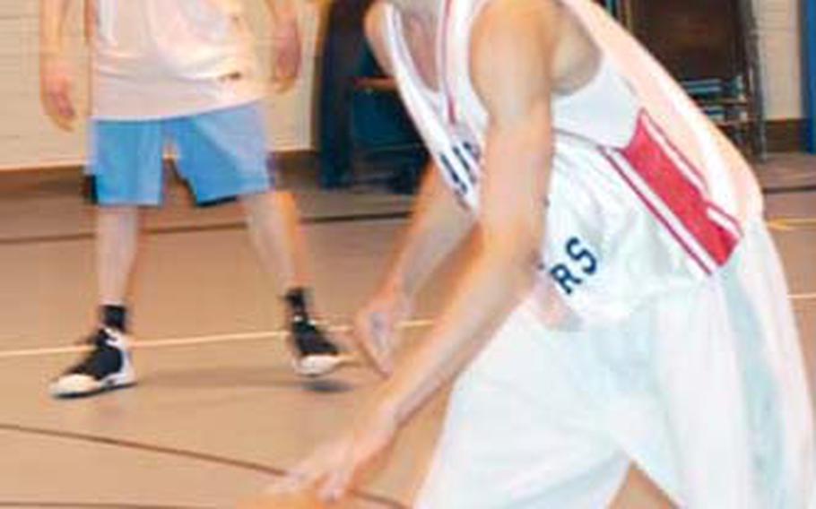 Aaron Miles practices at Lakenheath High School. Lakenheath Coach Alan Campbell called Miles, a senior forward, one of the team’s key players this year.