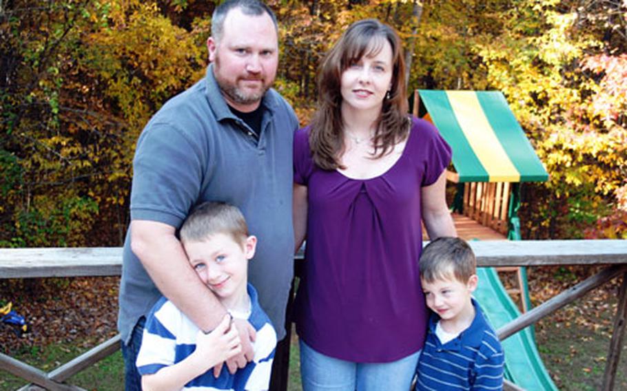 Iraq war veteran Mike McMichael — with his wife, Jackie, and sons Hunter, 7, and Alex, 5 — has struggled since surviving a roadside bomb blast in Iraq in November 2004. The McMichaels have dealt with his traumatic brain injury symptoms and a health care system that at the time had little experience with such injuries.