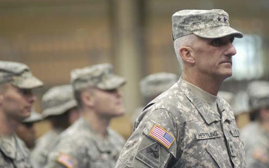 Maj. Gen. Mark P. Hertling, commander of the 1st Armored Division, stands with 27 of his troops during a welcome-home ceremony Wednesday in Wiesbaden, Germany.