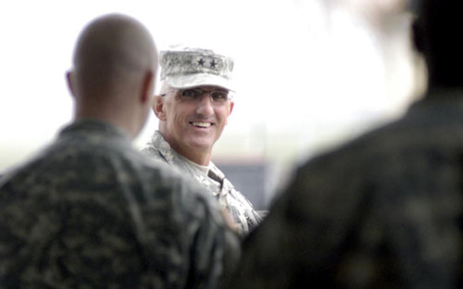 Maj. Gen. Mark P. Hertling waits outside a Wiesbaden gym along with 27 other soldiers who returned with him Wednesday from Iraq. The soldiers were in Iraq for 15 months.