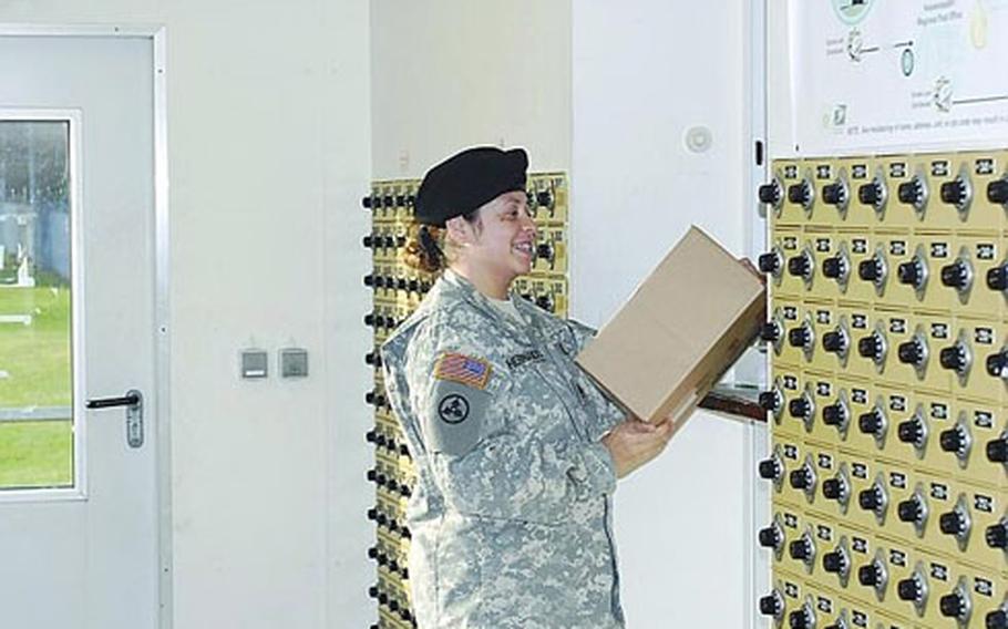 Army Staff Sgt. Estela Hernandez with the 486th Movement Control Team picks up her mail at Daenner Kaserne in Kaiserslautern, Germany, on Monday.