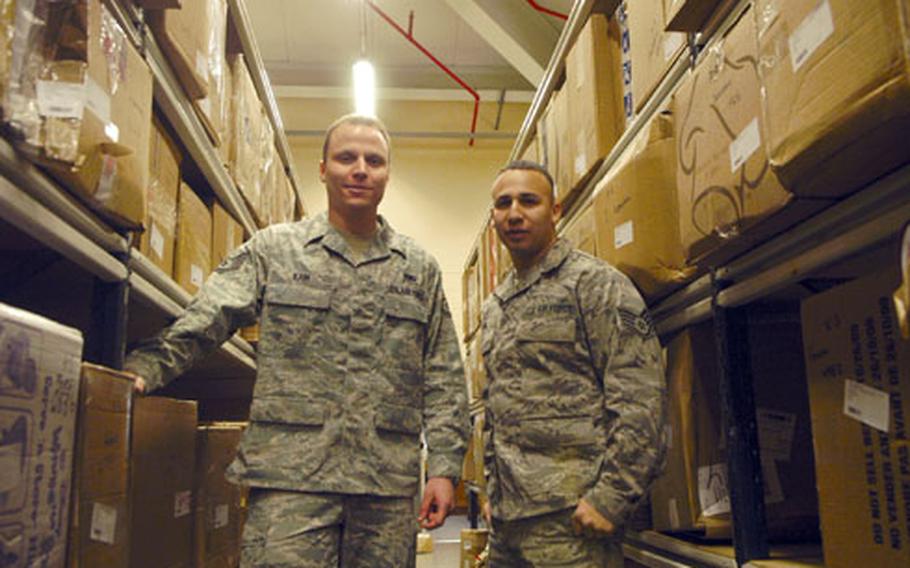 Staff Sgts. Aaron Kain, left, and Darian Lira of the RAF Mildenhall post office.