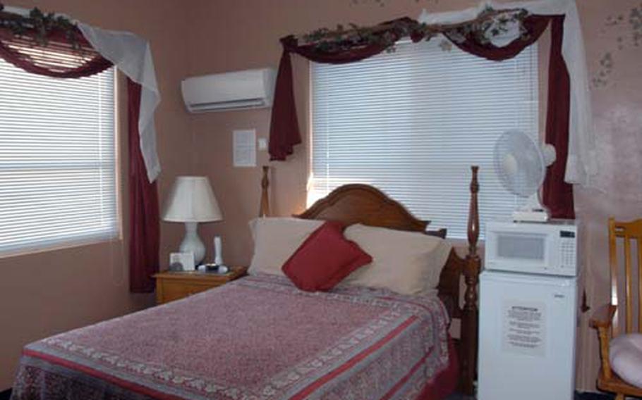 A bedroom inside one of the Stork’s Nest five cottages at Camp Lester in Okinawa. The facility provides free lodging and meals for expectant moms with high-risk pregnancies and families with infants in intensive care. The rooms in each cottage are adopted by service branches whose volunteers keep them spruced up and decorated.