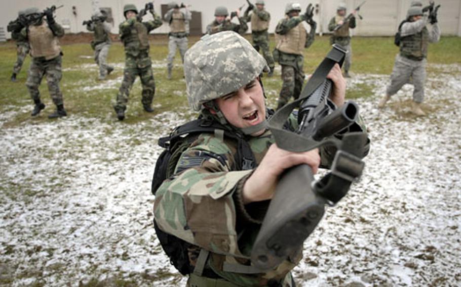 Air Force Staff Sgt. Jesse Reddam, assigned to the 86th Maintenance Squadron, practices the "smash" move along with other combat skills classmates during the rifle fighting portion of the course Thursday at Ensiedlerhof Air Station in Kaiserslautern, Germany.
