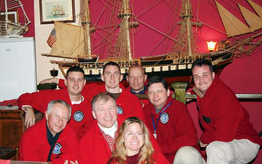 Team members pose for a photo. They are, front, from left, Jan Chrypinski, Kip Karl and Navy Reservist Lt. Sandra Salvatori; middle, from left, Army Capt. Al Eckart, Navy Lt. Brian Moore, Ralph Belander and Navy Reservist Lt. Stuart Gold; and back, Court Rawson.