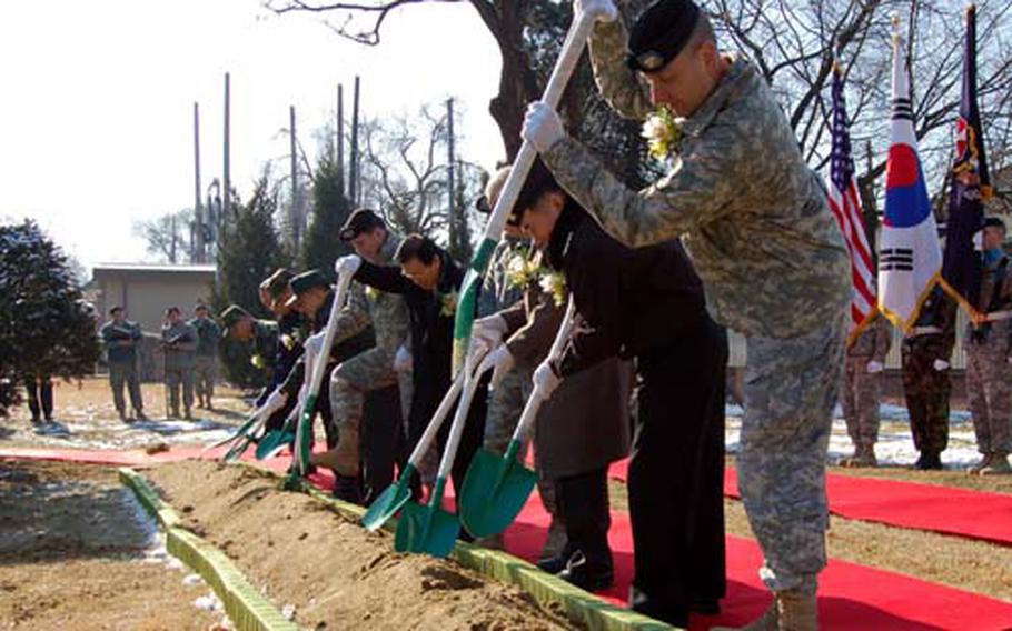 Officials from U.S. Forces Korea and the Republic of Korea/U.S. Friendship Society prepare to turn ceremonial shovels full of dirt Tuesday during the groundbreaking ceremony for a statue of Gen. Walton Walker at Yongsan Garrison.