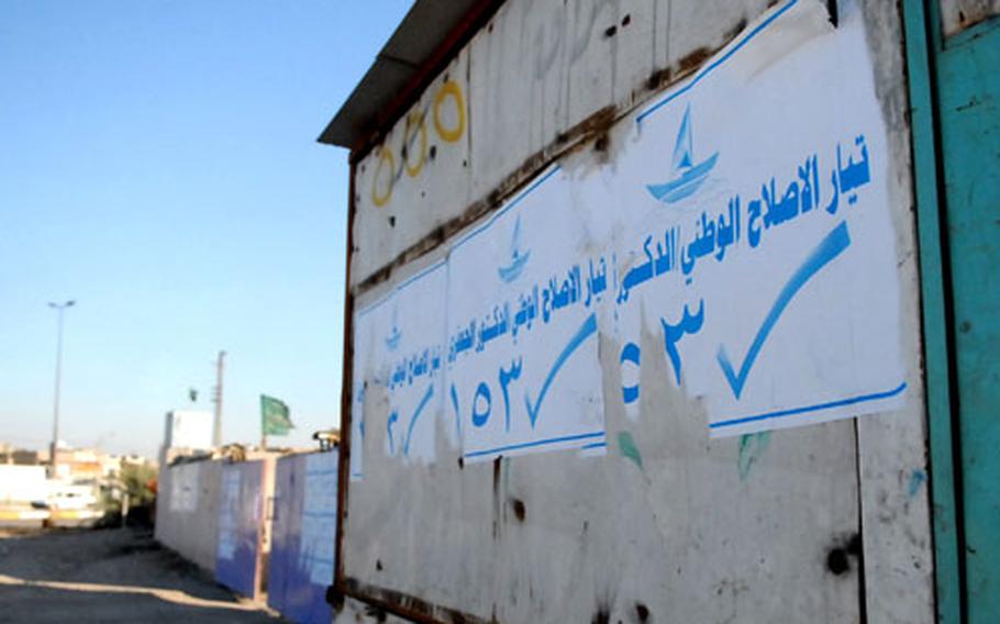 Political posters advertise a National Reform System candidate in Baghdad’s Sadr City district. Such posters are rare in Sadr City because few candidates have the money for widespread campaigning.