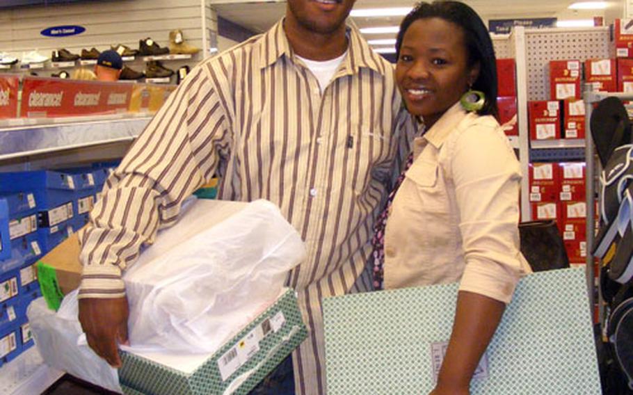 Fletcher Beaman and his wife, Tess, exchange sneakers they bought for each other that were just a squidge too small.