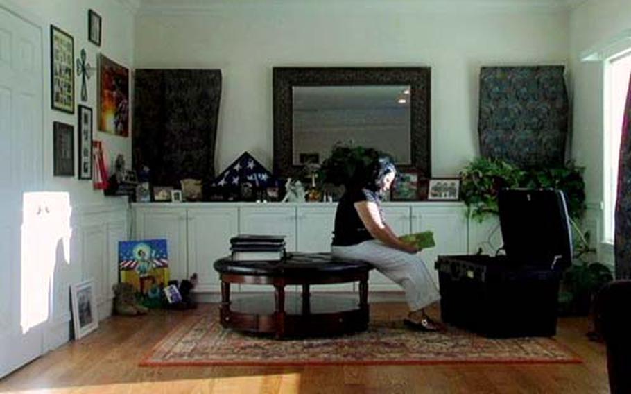 Sitting next to the trunk of her son&#39;s belongings, Doris Kent reads the diary left behind by Army Spc. Jonathan Santos, killed in October 2004 in Iraq less than a month after his 22nd birthday.