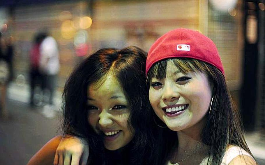 Two South Korean girls hang out in Itaewon’s entertainment district. The area – famed over the years for its bars, brothels and crowds of U.S. soldiers from nearby Yongsan Garrison – is transforming as a number of upscale stores, cozy coffee shops and gourmet restaurants have opened in the past few years.