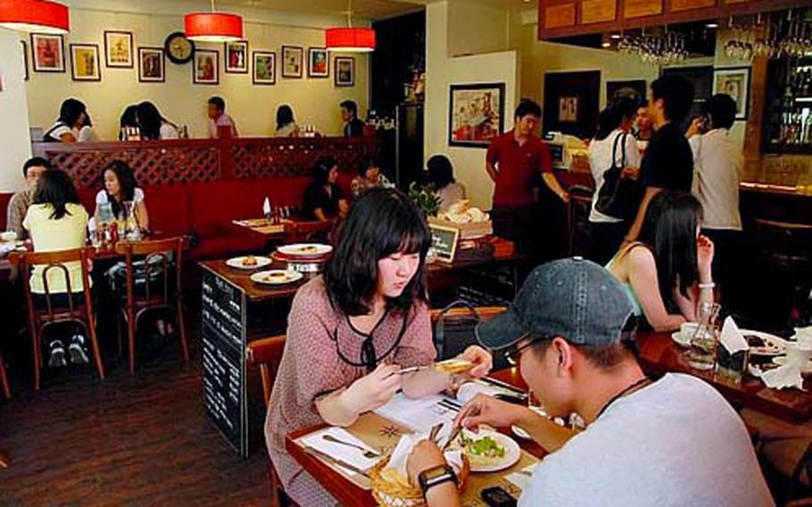 South Korean customers fill Le Saint-Ex during the middle of a weekday afternoon. The French bistro was one of the first foreign restaurants to open in Itaewon.