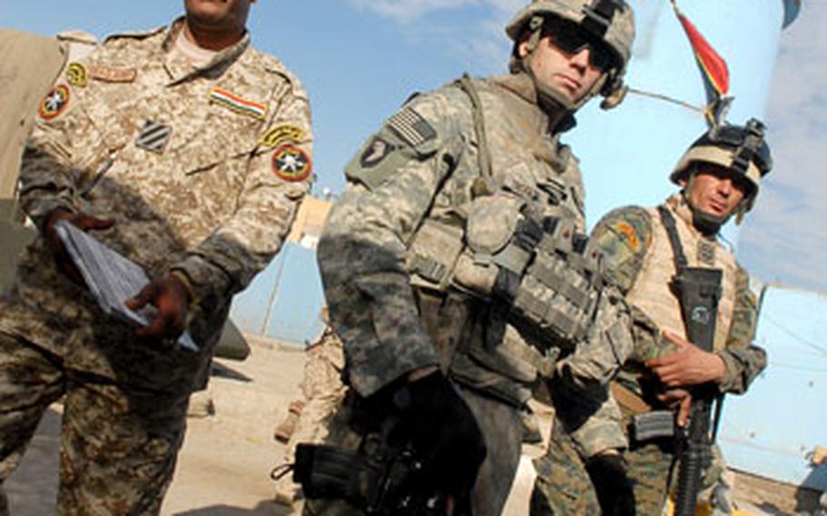 Staff Sgt. Lewis Trogler, an acting platoon sergeant in Company A, 1st Battalion, 6th Infantry Regiment, inspects an Iraqi Army checkpoint Dec. 27 in Sadr City overseen by Iraqi Army 1st Sgt. Hassan al-Harabi (left) and another Iraqi soldier. The withdrawal of American forces from Iraq will likely force the Iraqi Army to spend more time patrolling around communities instead of manning checkpoints like these.